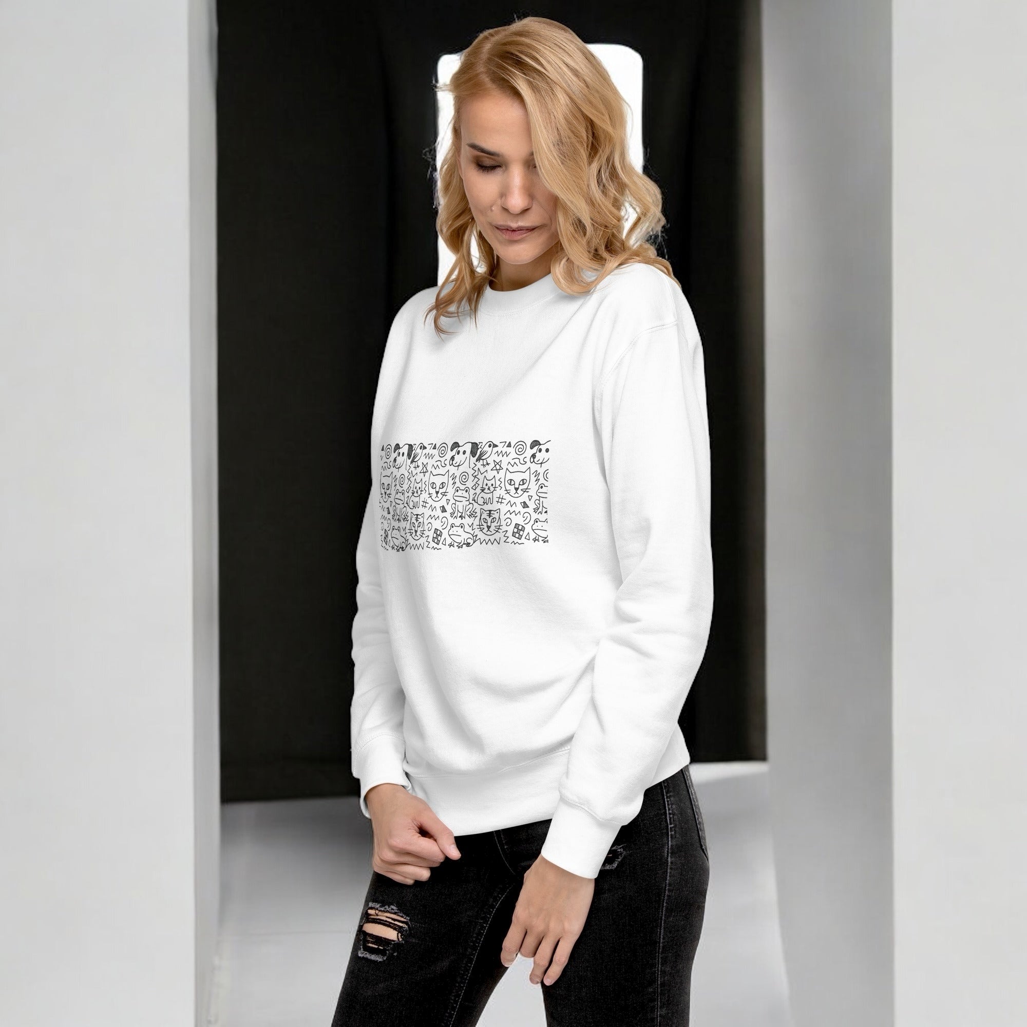 Woman in white doodle sweater - orbit clothing - unisex