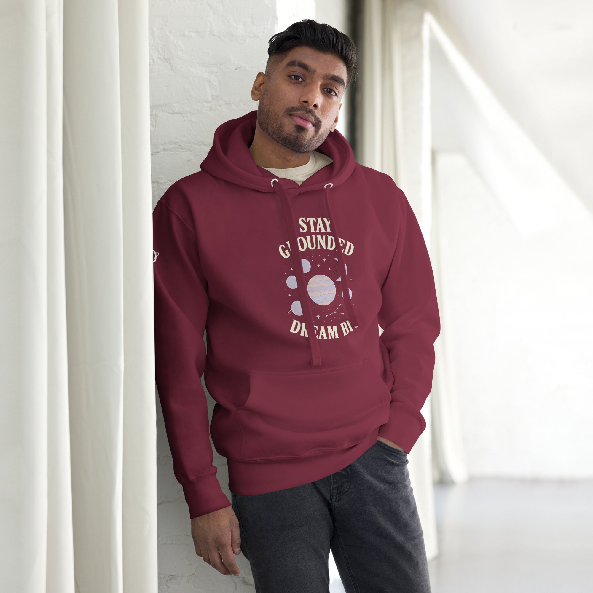 Man wearing maroon hoodie with dream big stay grounded printed on it - Orbit Clothing - Unisex