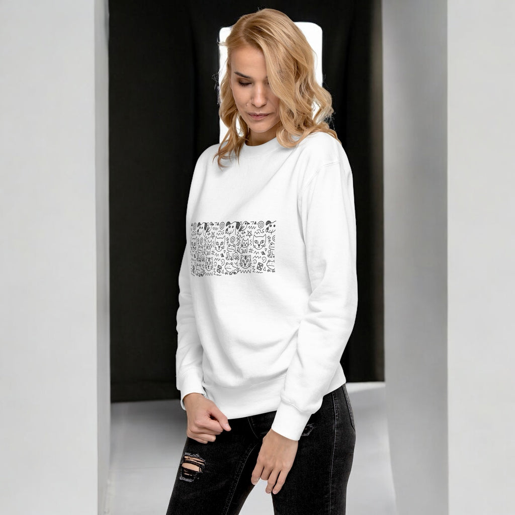 Woman in white doodle sweater - orbit clothing - unisex