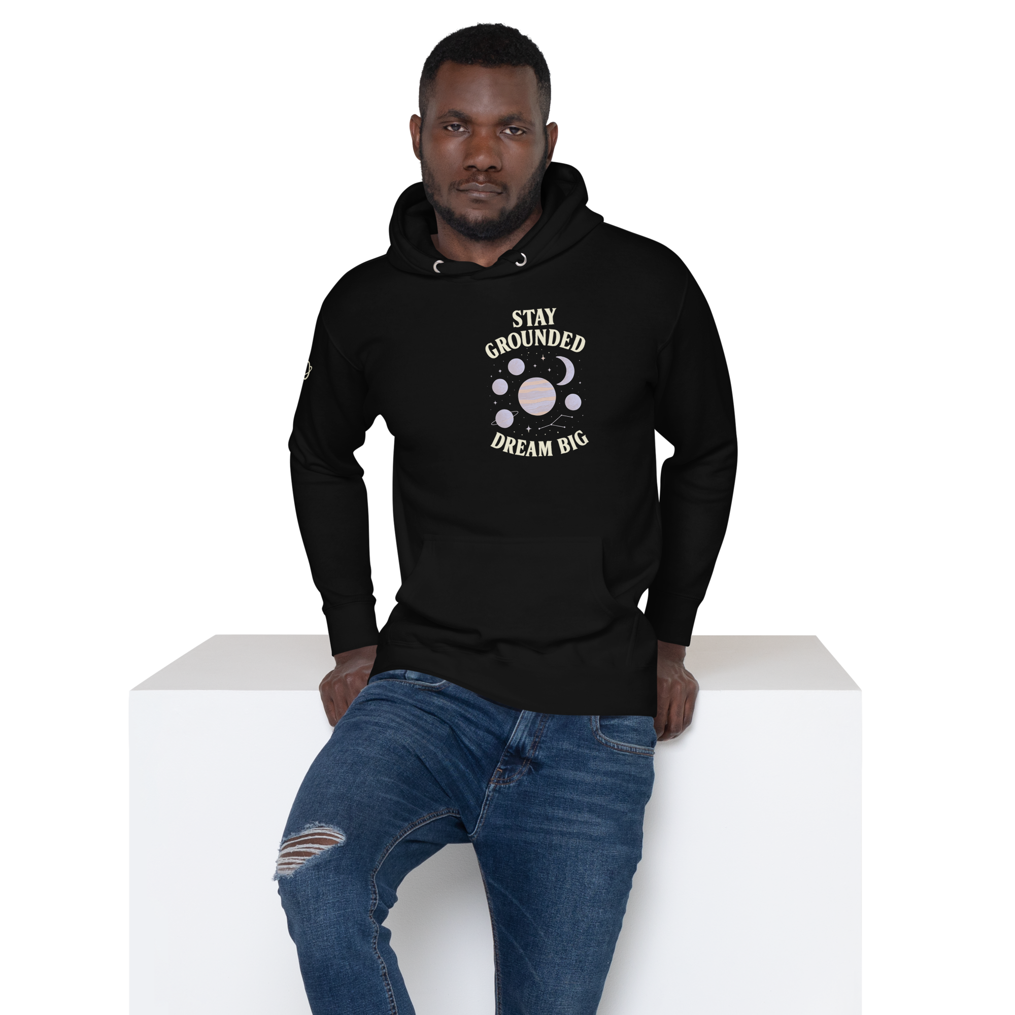 Man wearing black stay grounded dream big hoodie by orbit clothing - unisex